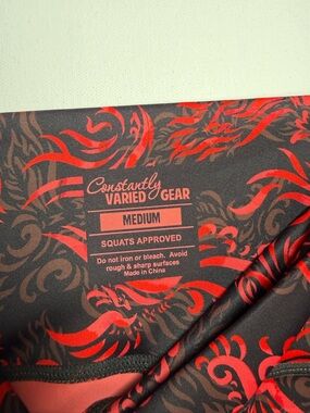 Constantly Varied Gear Black Leggings with Red Scroll Print